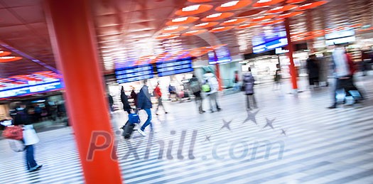 Trainstation rush: people rushing to get on their train, to get to work, to a meeting and so on (motion blurred image; color toned image) Trainstation rush: people rushing to get on their train, to get to work, to a meeting and so on (motion blurred image; color toned image)