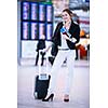 Pretty young female passenger at the airport (shallow DOF; color toned image)