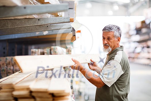 Senior man buying construction wood in a DIY store Senior man buying construction wood in a DIY store