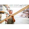 Senior man buying construction wood in a  DIY store
