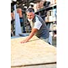 Senior man buying construction wood in a  DIY store