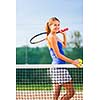 Portrait of a pretty young tennis player with copyspace