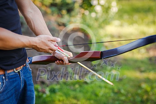 Young archer training with the bow Young archer training with the bow
