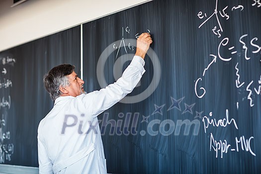 Senior chemistry professor writing on the board while having a chalk and blackboard lecture (shallow DOF; color toned image) Senior chemistry professor writing on the board while having a chalk and blackboard lecture (shallow DOF; color toned image)