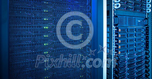 Server rack cluster in a data center (shallow DOF; color toned image) Server rack cluster in a data center (shallow DOF; color toned image)