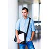 Handsome college student on campus (shallow DOF; color toned image)