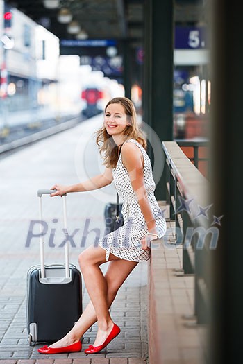 Pretty young woman at a train station Pretty young woman at a train station