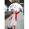 Pretty young woman at a train station
