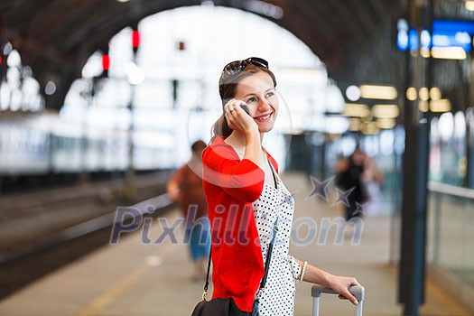 Pretty young woman at a train station Pretty young woman at a train station
