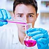 young male researcher carrying out scientific research in a lab  (shallow DOF; color toned image)