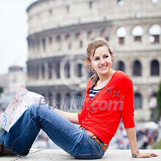 Portrait of a pretty, young, female tourist in Rome, Italy (with Colosseum in the background)