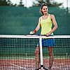 pretty, young female tennis player on the tennis court (shallow DOF, selective focus)