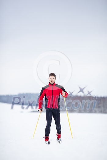 Cross-country skiing: young man cross-country skiing on a lovely snowy winter day Cross-country skiing: young man cross-country skiing on a lovely snowy winter day