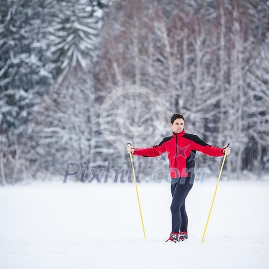 Cross-country skiing: young man cross-country skiing on a lovely snowy winter day Cross-country skiing: young man cross-country skiing on a lovely snowy winter day