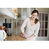 Young woman doing housework, cleaning the kitchen