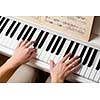Playing Piano (shallow DOF; color toned image)