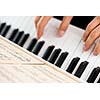 Playing Piano (shallow DOF; color toned image)