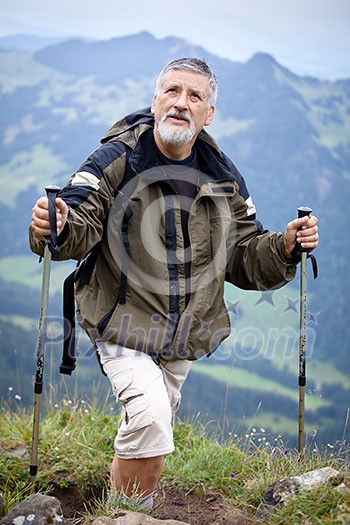 Active senior hiking in high mountains (Swiss Alps) Active senior hiking in high mountains (Swiss Alps)