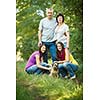Family portrait - Family of four with a cute dog outdoors