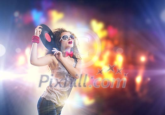 Young pretty girl dj at disco party holding vinyl Young pretty girl dj at disco party holding vinyl