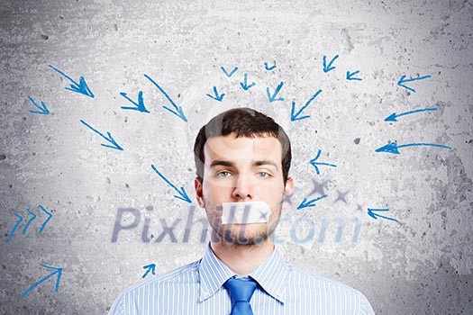 Young handsome businessman with adhesive tape on mouth Young handsome businessman with adhesive tape on mouth