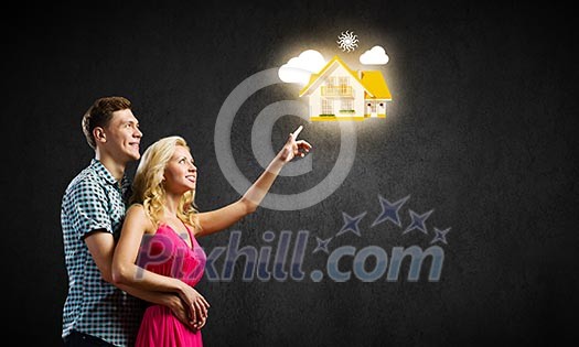 Conceptual image of young couple hugging each other and dreaming Conceptual image of young couple hugging each other and dreaming