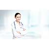 Young attractive woman doctor with stethoscope on neck