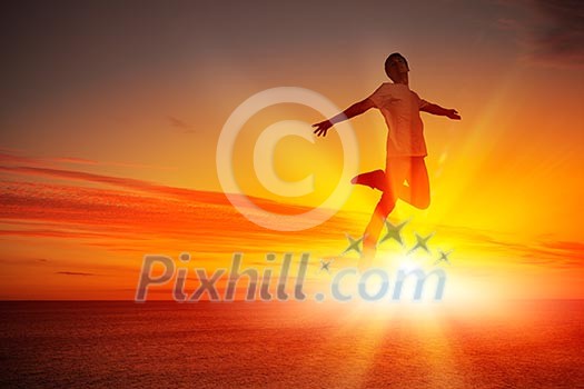 Silhouette of dancer jumping against city in lights of sunrise Silhouette of dancer jumping against city in lights of sunrise