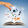 Opened book with business concept icons and hand making choice