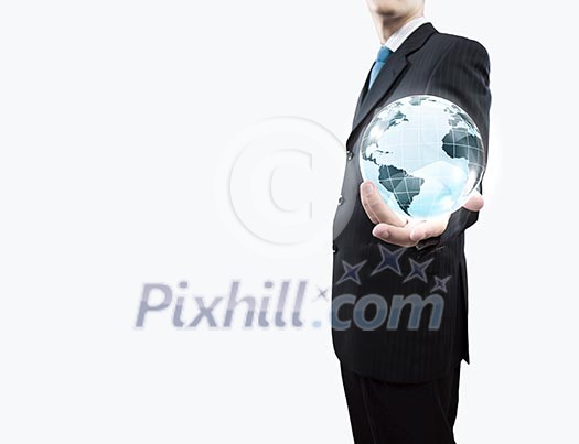 Young businessman holding Earth planet in palm Young businessman holding Earth planet in palm