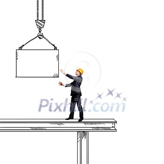 Businessman in helmet standing on construction beam Businessman in helmet standing on construction beam