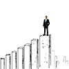 Successful businessman standing on drawn graph bars