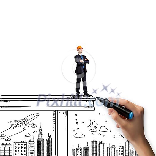 Businessman in helmet standing on construction beam Businessman in helmet standing on construction beam