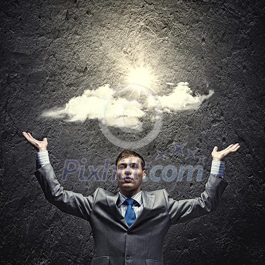 Young handsome businessman wit sun shining above head Young handsome businessman wit sun shining above head