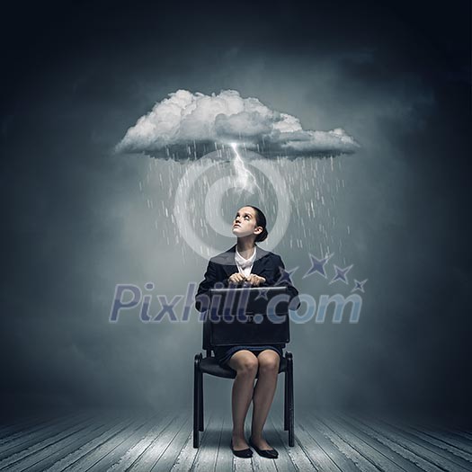 Young upset businesswoman with suitcase sitting on chair Young upset businesswoman with suitcase sitting on chair