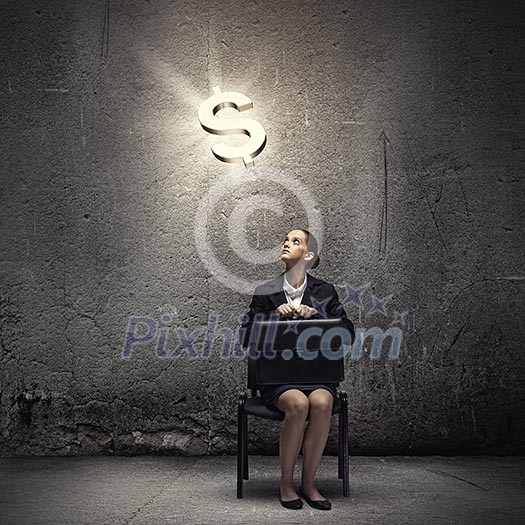 Young businesswoman sitting on chair and looking at dollar symbol above Young businesswoman sitting on chair and looking at dollar symbol above