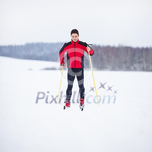 Cross-country skiing: young man cross-country skiing on a lovely snowy winter day Cross-country skiing: young man cross-country skiing on a lovely snowy winter day