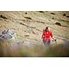 Pretty, young woman hiking in mountains