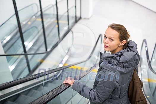 Young woman at a modern shopping center Young woman at a modern shopping center