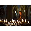 Young woman praying in a church