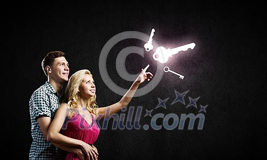 Conceptual image of young couple hugging each other and dreaming Conceptual image of young couple hugging each other and dreaming