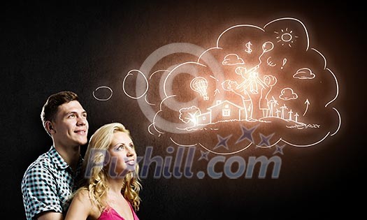 Conceptual image of young couple hugging each other and dreaming Conceptual image of young couple hugging each other and dreaming