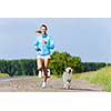 Young healthy girl running outdoor with her dog