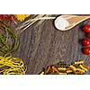 Cherry tomatoes and vegetables on kitchen table