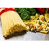 Close up of macaroni and other ingredients on kitchen table