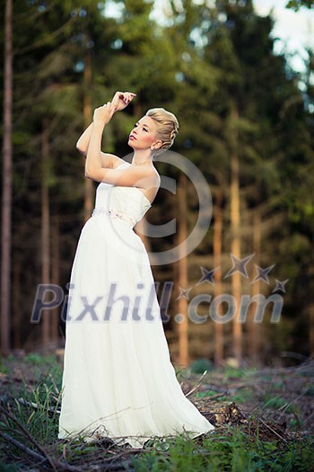 Lovely bride outdoors in a forest Lovely bride outdoors in a forest