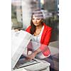 Pretty young female college student/secretary using a copy machine (shallow DOF; color toned image)