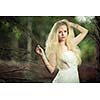 Lovely bride outdoors in a forest