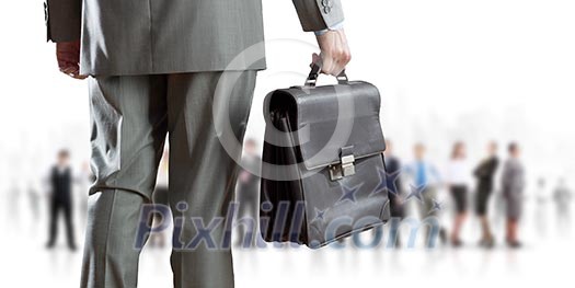 Back view of businessman with business team at background Back view of businessman with business team at background