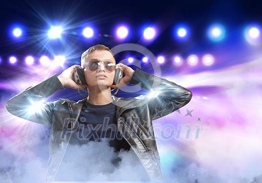 Image of young man rock musician at concert Image of young man rock musician at concert
